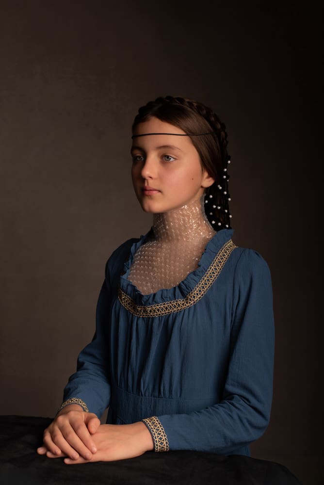 Fine art portrait from the Modern Heirlooms series featuring a sculptural veil created from repurposed bubble wrap.